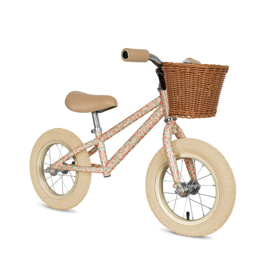 Children's balance bike with a basket on a white background.Knoges Slojd