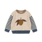 Children's sweater with a leaf design on a white background
