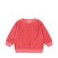 Pink striped sweater on a white background