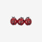 Three red ladybug-shaped earrings on a white background
