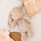 A gift bundle for new baby with muslin teddy and booties