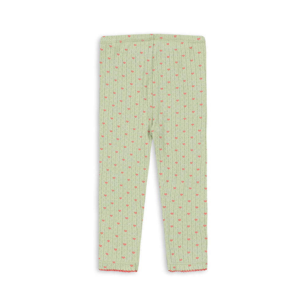 Light green children's leggings with a vertical striped pattern and small red accents, shown flat against a white background.