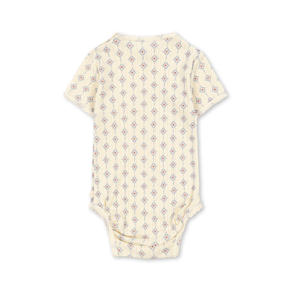Baby onesie with a subtle pattern on a white background