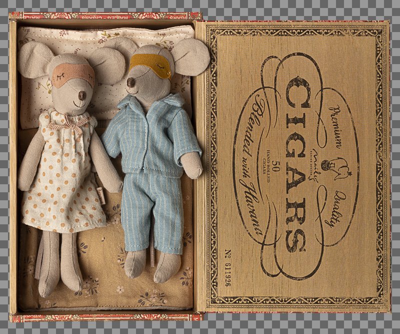 Two teddy bears, a girl in a dress and a boy in overalls, inside an open cigar box with vintage design.