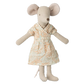Stuffed mouse toy wearing a floral dress on a white background