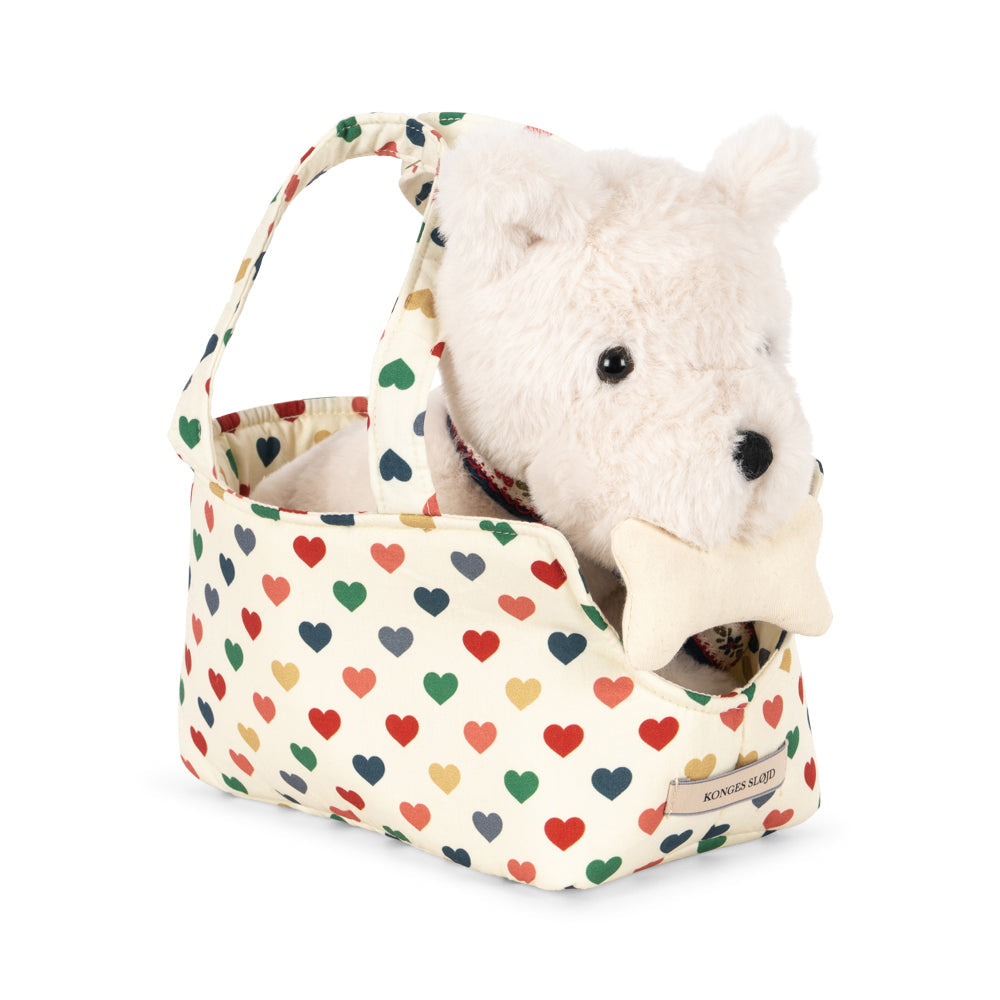 Soft Terry puppy in a cute hearth carry cot
