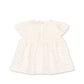 White dress with a subtle pattern on a white background