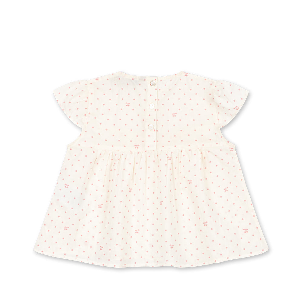 White dress with a subtle pattern on a white background