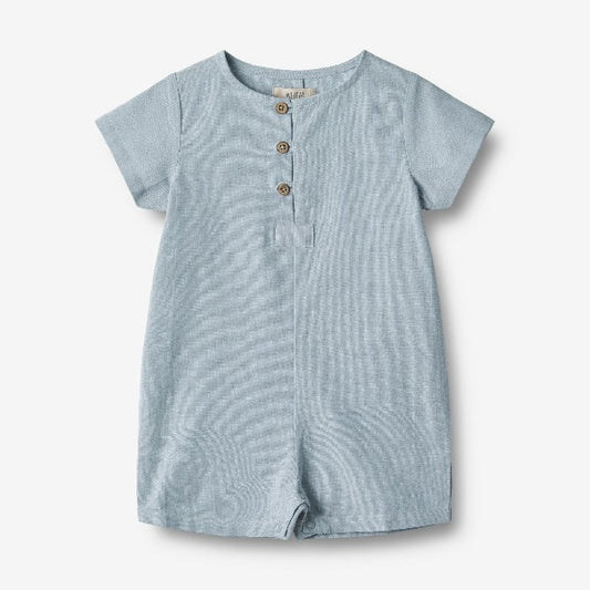 A light cotton summer play suit, short sleev and cropped legs, with wooden buttons on the neck