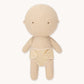 Beige cloth doll on a white background