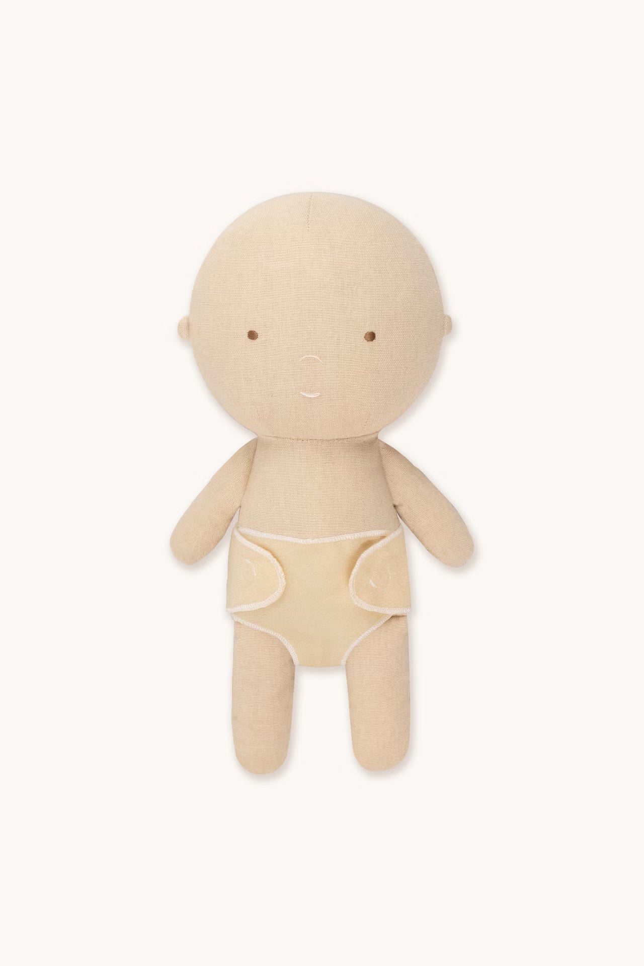 Beige cloth doll on a white background