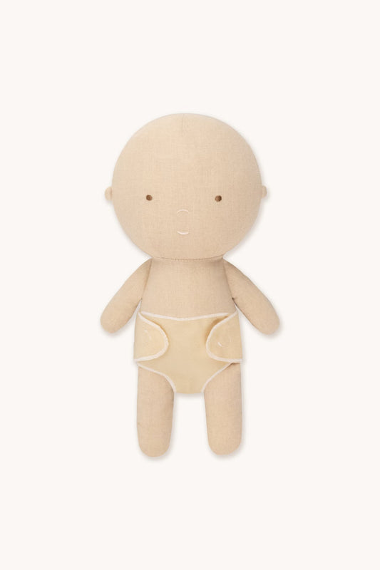 Beige cloth doll on a white background