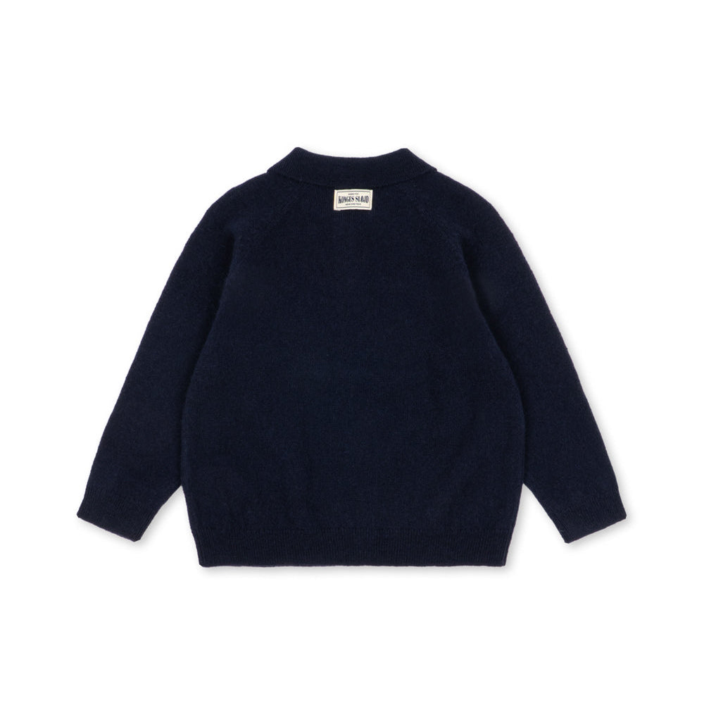 A dark navy blue knit sweater shown from the back, featuring a crew neck and long sleeves, laid flat against a solid white background.