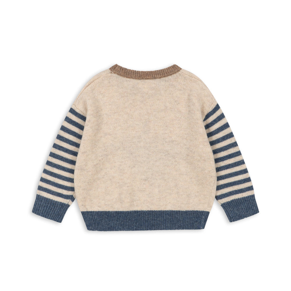 Beige sweater with blue striped sleeves on a white background