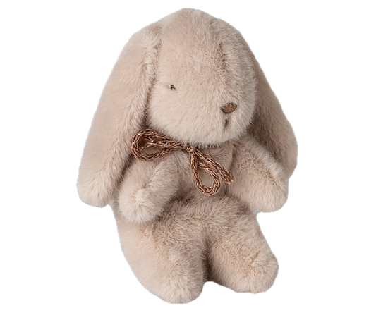 Plush bunny toy with a gold bow on a white background