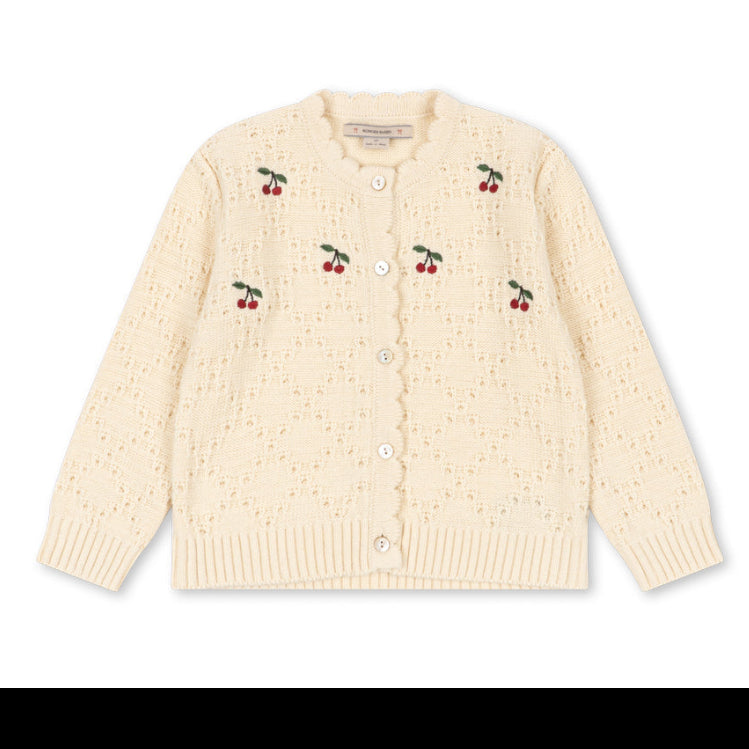 A cream-colored knit cardigan sweater with small embroidered cherry motifs on the front, displayed flat against a plain white background.