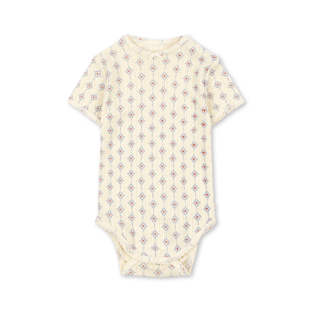 Baby onesie with a subtle pattern on a white background