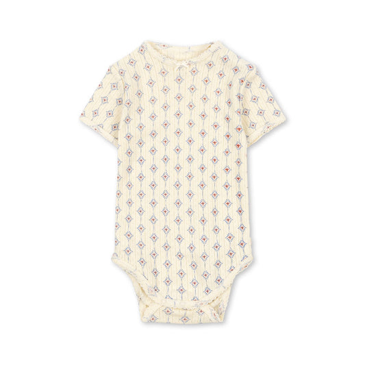 Baby onesie with a subtle pattern on a white background