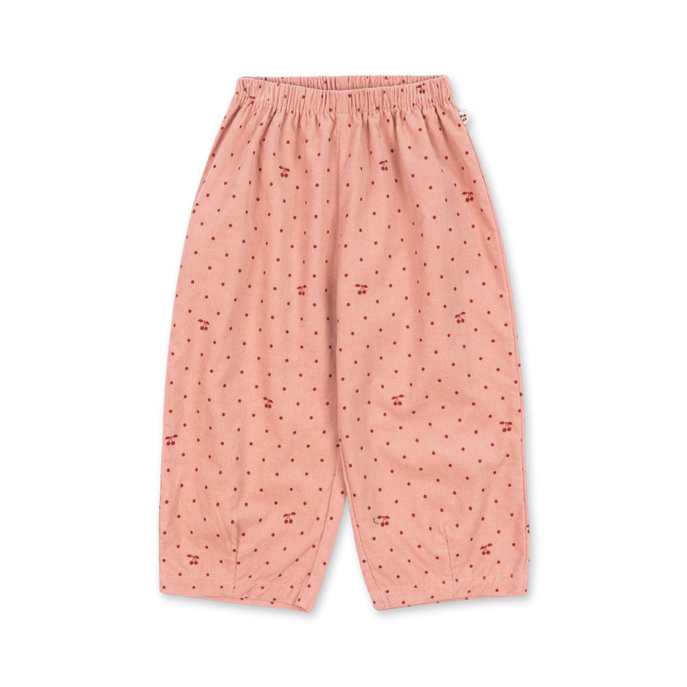 Pink pajama pants with a subtle pattern on a white background