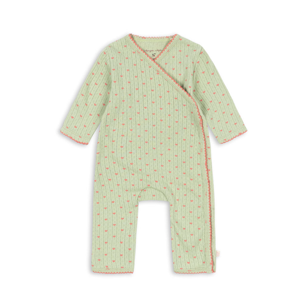 A baby long-sleeve footless wrap jumpsuit in light green with a small red floral pattern and red trim, shown flat on a white background.
