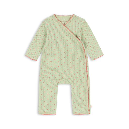 A baby long-sleeve footless wrap jumpsuit in light green with a small red floral pattern and red trim, shown flat on a white background.