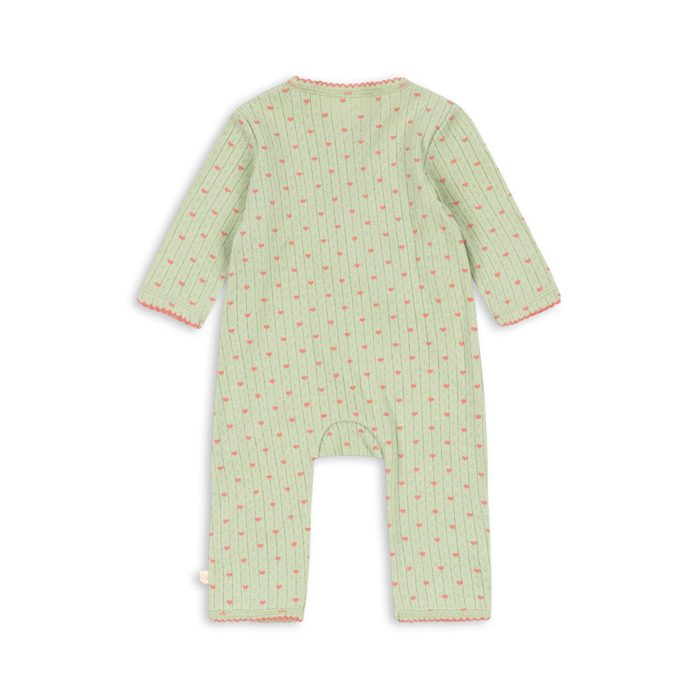 A baby long-sleeve footless romper in light sage green with a small repeating red and yellow floral pattern, shown from the back on a white background.