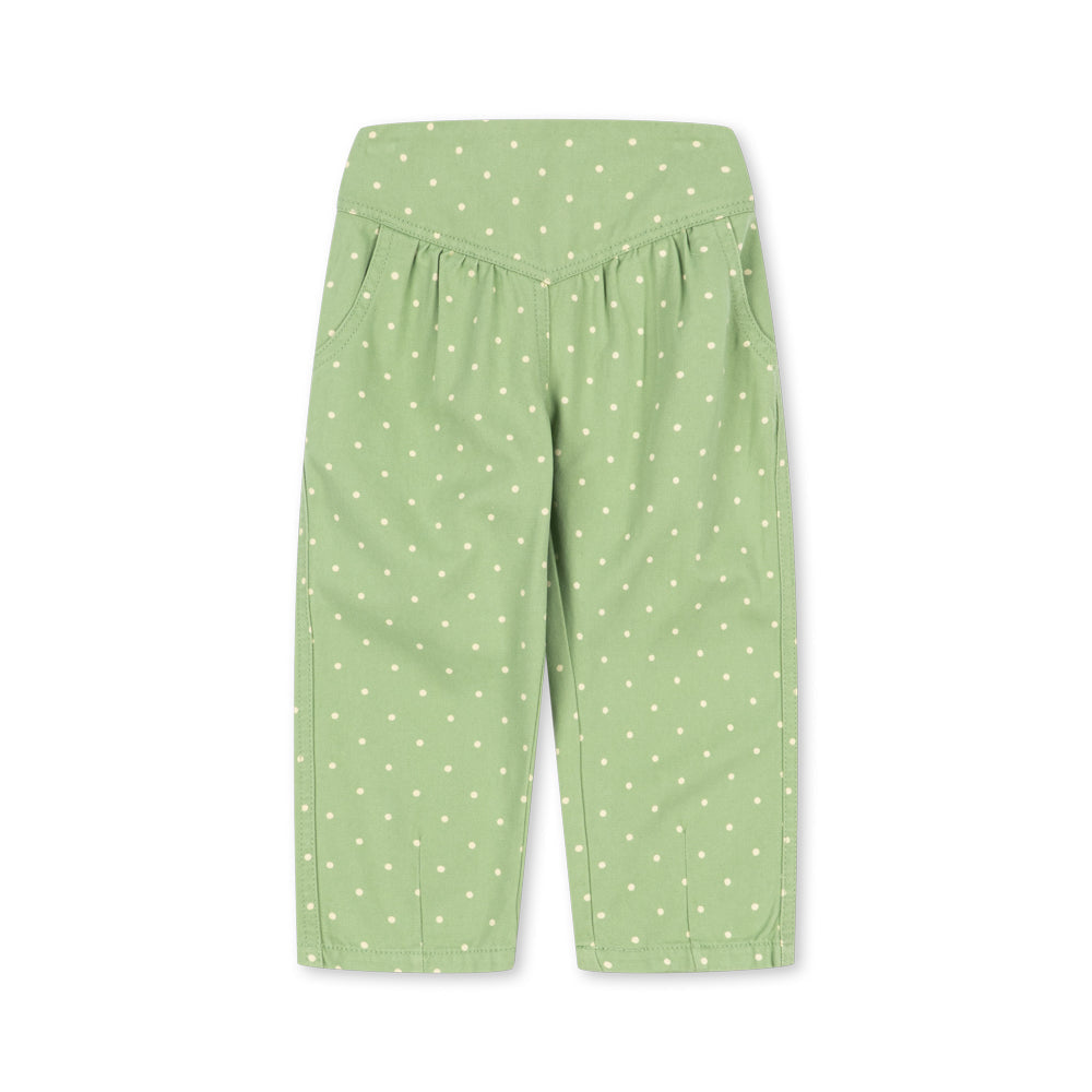 Light green cropped pants with a white polka dot pattern, featuring an elastic waistband and side pockets, shown flat on a white background.