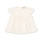 Baby girls White dress with small patterns on a white background