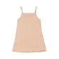 Beige slip dress on a white background
