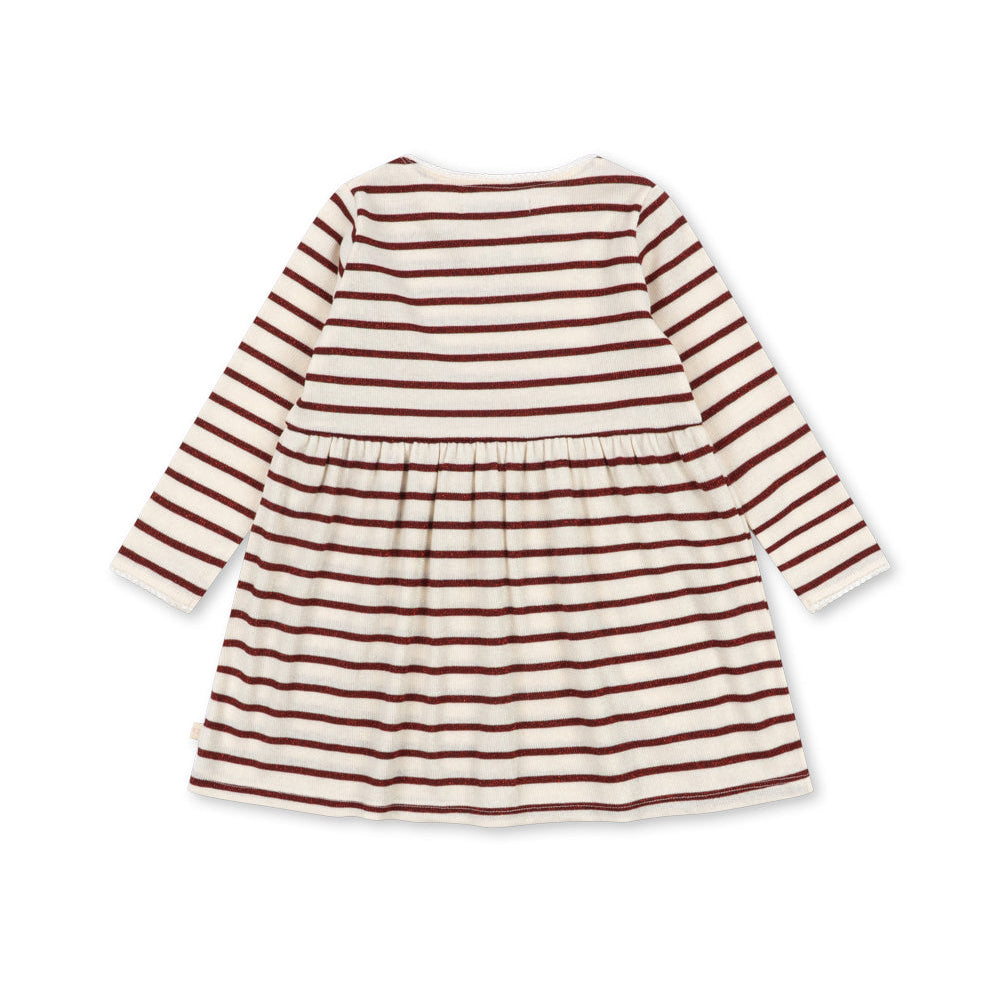 A long-sleeve baby dress with horizontal rust red and cream stripes, shown from the back on a solid white background.