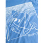 A close-up of a blue T-shirt featuring a white line-art graphic of Moomin characters, including Moomin and the text 'moomin x' near the lower right of the print.