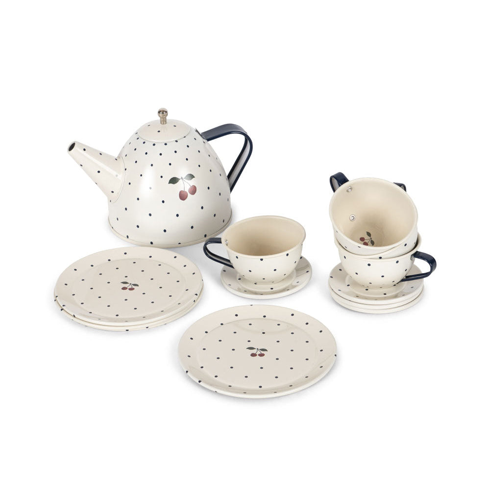 Speckled ceramic tea set with teapot, cups, and saucers on a white background
