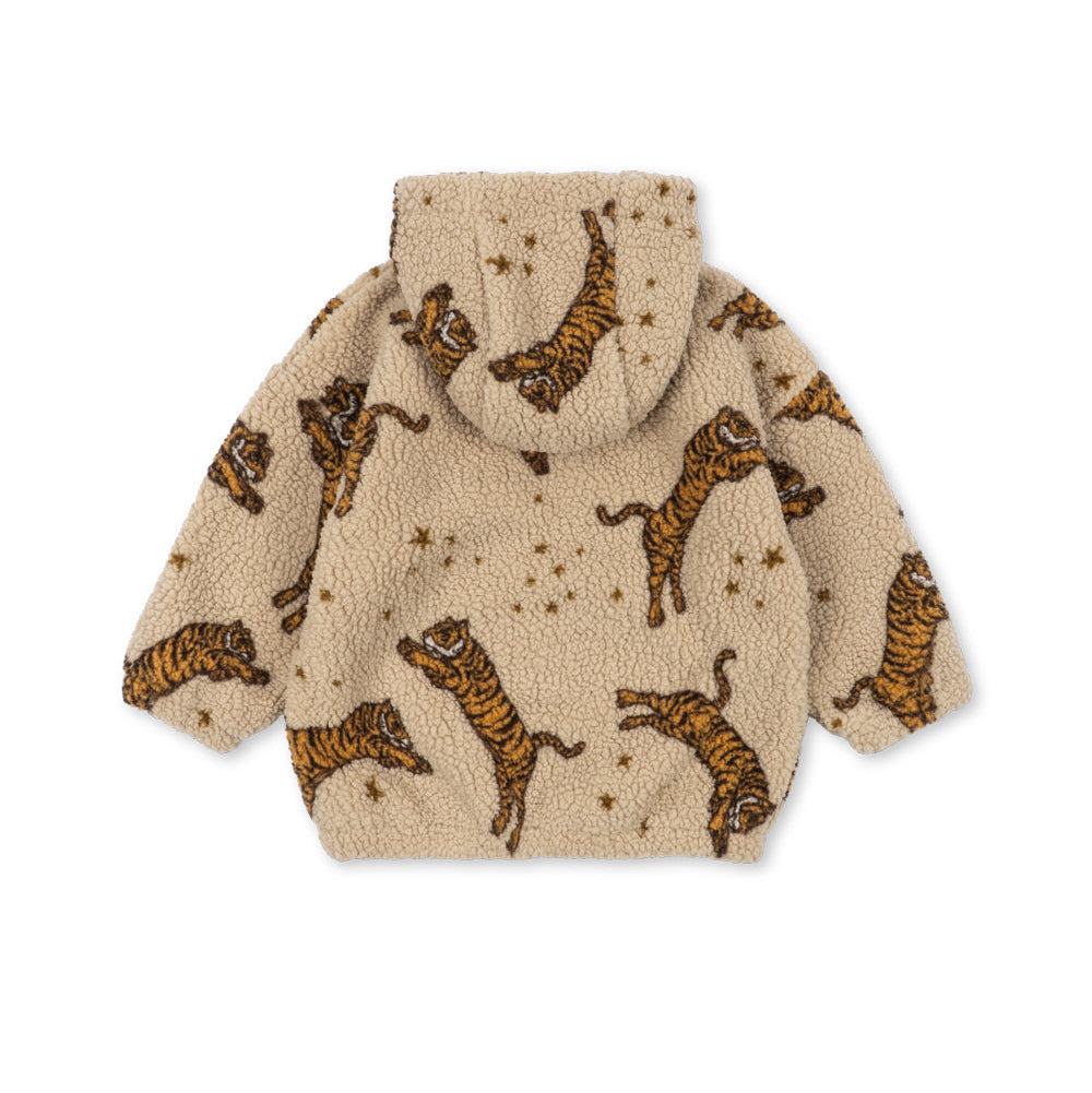 A beige sherpa fleece hooded jacket with an all-over print of orange and black tiger figures and small gold stars, shown against a plain white background.