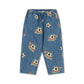 Blue denim pants for kids featuring an all-over print of soccer balls in space with colorful rockets and stripes, displayed flat against a white background.