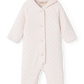 A light pink hooded baby jumpsuit with a tiny repeating floral pattern, featuring a snap-button front and long raglan sleeves, shown against a plain white background.