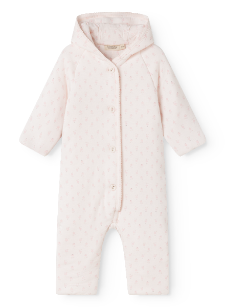 A light pink hooded baby jumpsuit with a tiny repeating floral pattern, featuring a snap-button front and long raglan sleeves, shown against a plain white background.