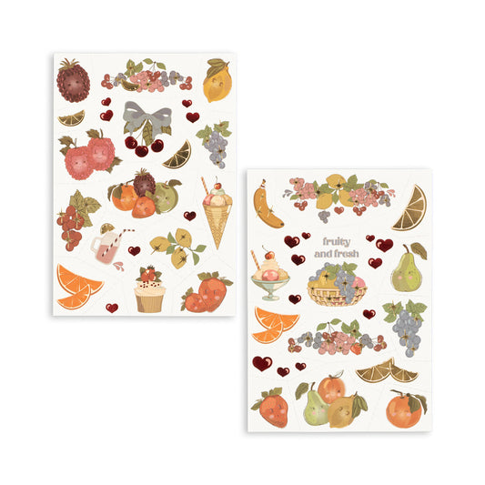 Two sheets of decorative stickers with fruit and dessert designs on a white background.