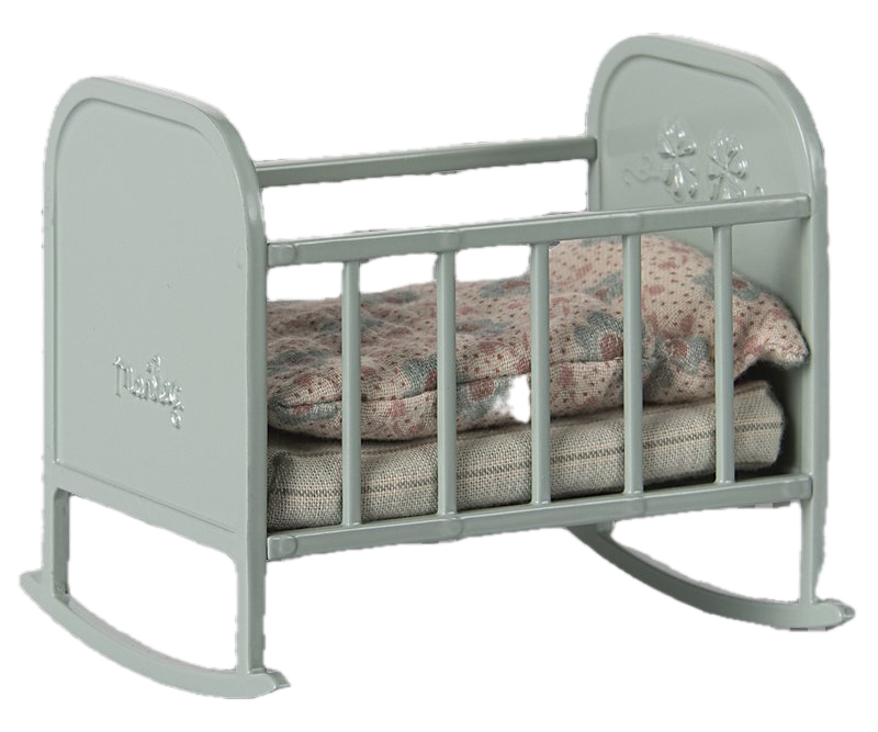 Gray baby crib with floral bedding on a white background