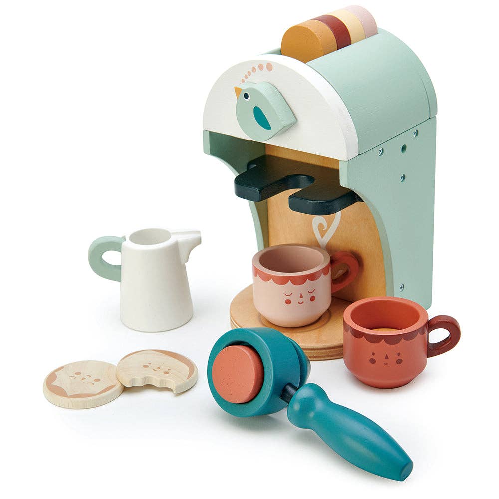 Toy coffee machine set with cups and a grinder on a white background