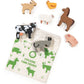 A children's wooden stacking farm-themed toy set with multiple animal pieces and a printed fabric bag. The set includes a cow, sheep, horse, chicken, goat, pig, and donkey, with the bag printed 'STACKING FARM FRIENDS' and decorated with green farm illustrations on a white background.