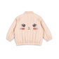 Pink children's jacket with a cat face design on a white background