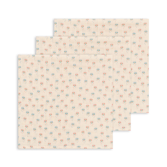 Two folded fabric swatches with a subtle pattern on a white background