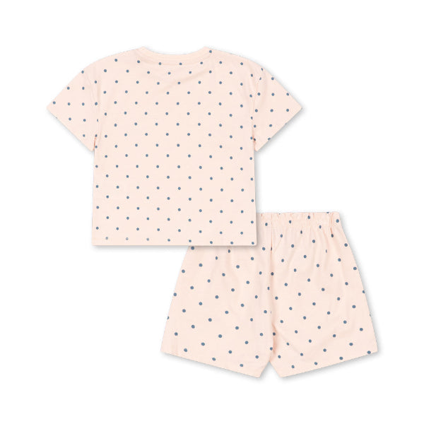 Pink polka dot pajama set on a white background