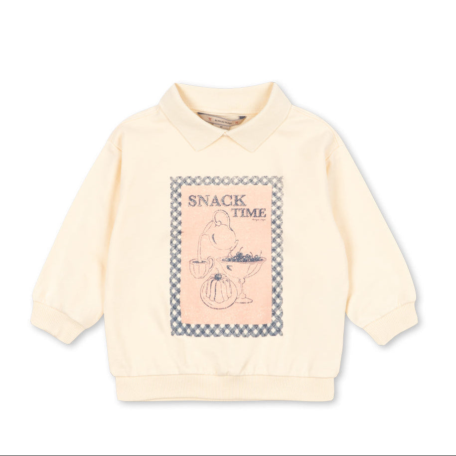Light pink sweater with graphic design on a white background