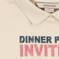 Beige polo shirt with 'Dinner Party Invite' text on a white background