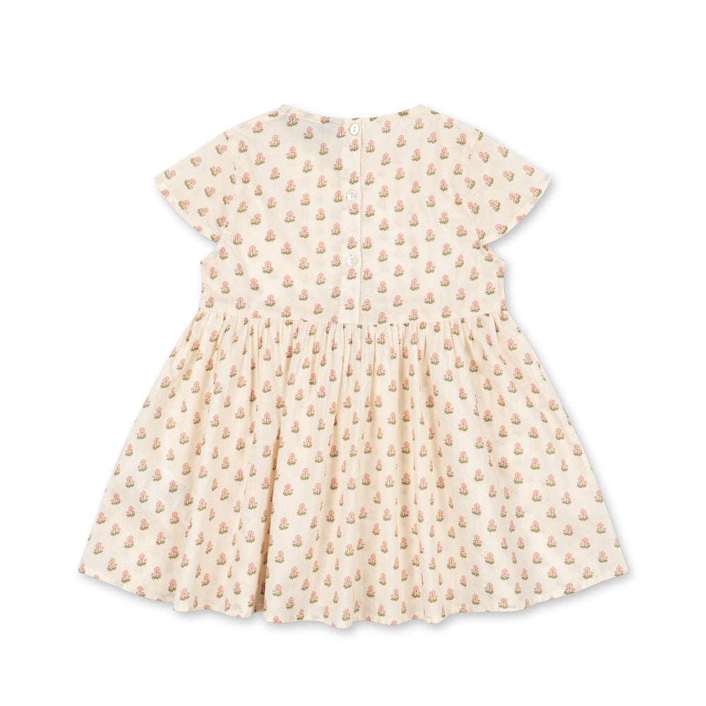 Beige dress with a subtle pattern on a white background