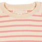 Close-up of a ribbed knit crewneck sweater with horizontal pink and cream stripes, showing the inner neck label that reads 'Raspberry Creek'.