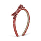 A glittery red headband with a matching bow on top, shown against a plain white background.