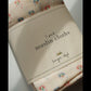 Pack of muslin cloths with floral design on a white surface