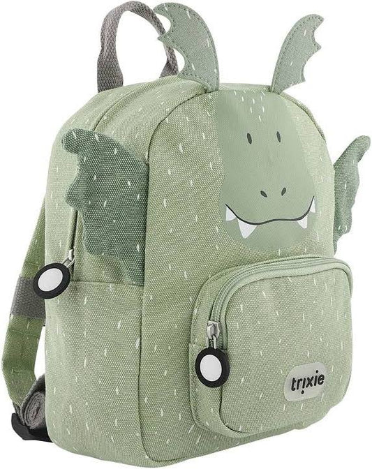 A light green dragon-themed children's backpack with a printed face, wings, and teeth, featuring a front zippered pocket and a visible Tryxie brand patch.